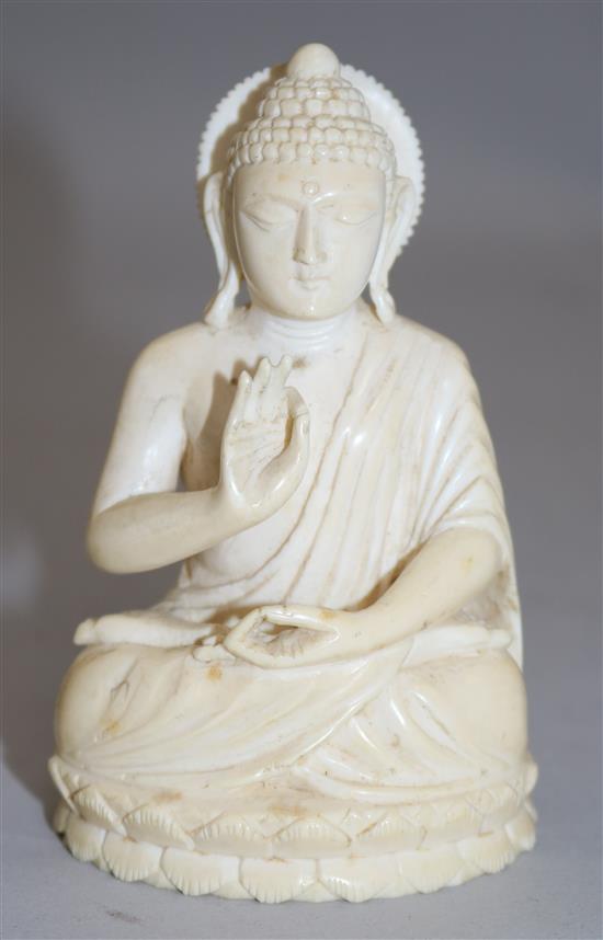 A Chinese ivory seated figure of Buddha Shakyamuni, early 20th century, 11cm